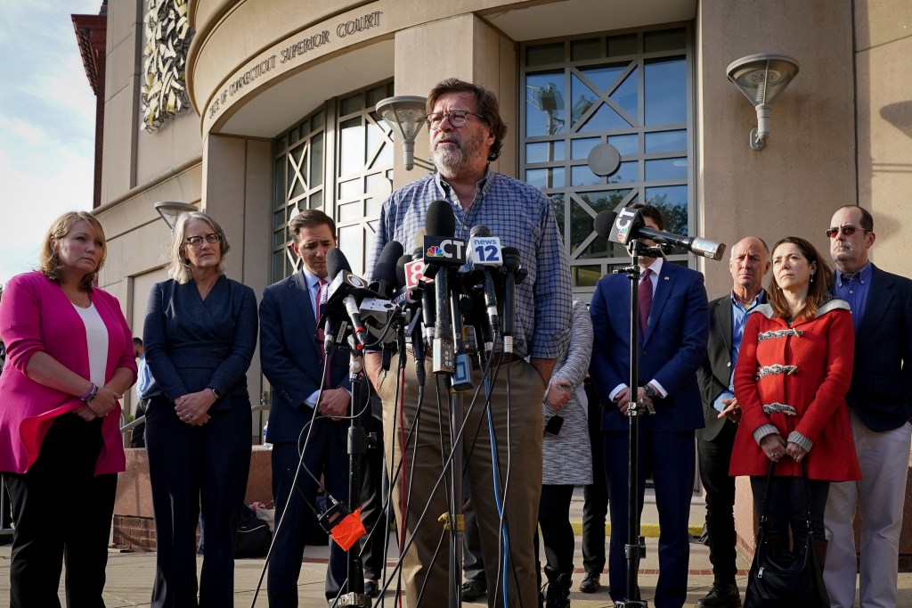 Bill Sherlach, husband of Mary, one of the Sandy Hook School shooting victims, speaks to the media after jurors returned a $965 million dollar judgement in the defamation trial against Alex Jones,