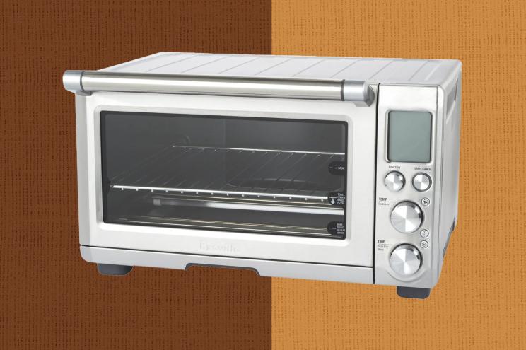 A toaster oven with a glass door