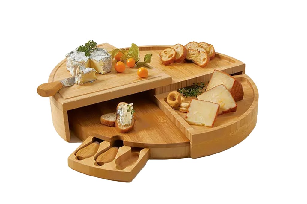 A wooden board with various types of cheese and bread slices