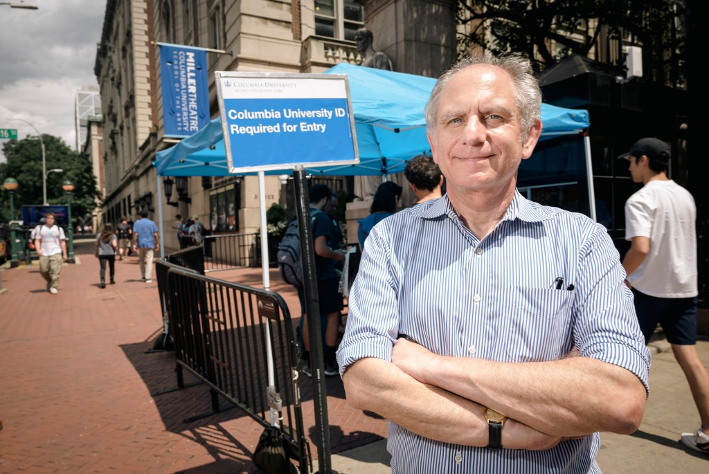 Professor Clifford Stein standing at the entrance of Columbia University 