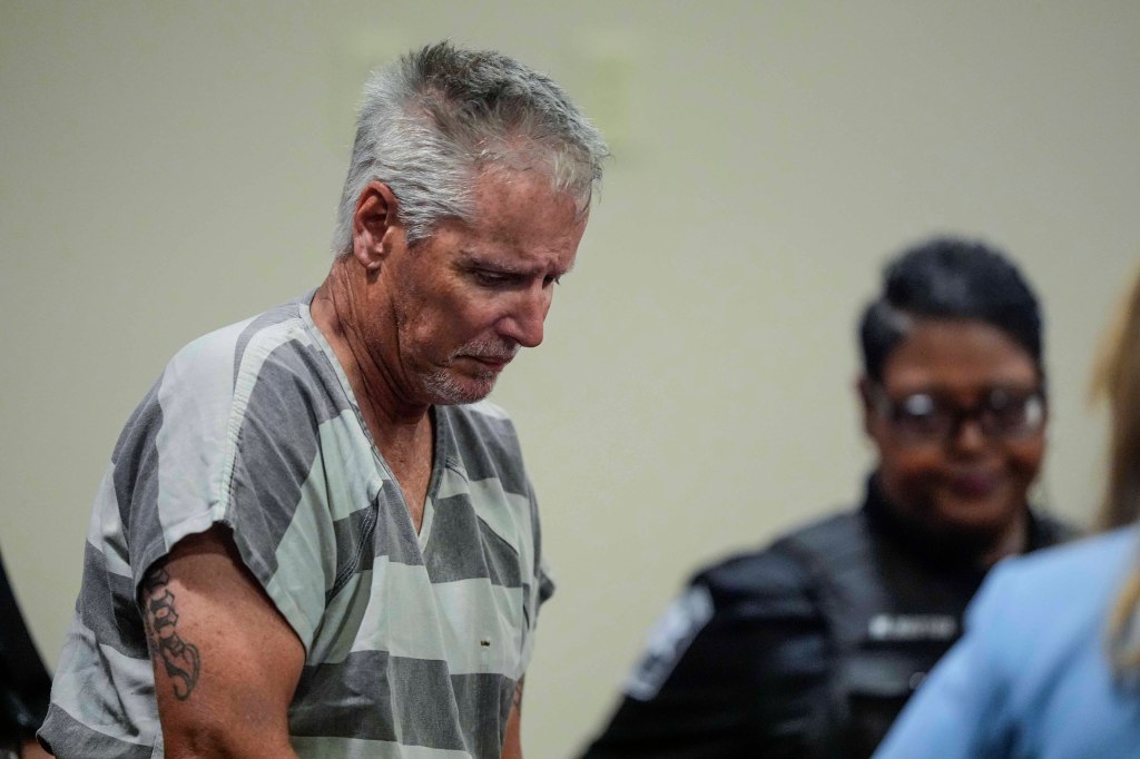 Colin Gray, father of Apalachee High School shooter, entering the Barrow County courthouse with a somber expression