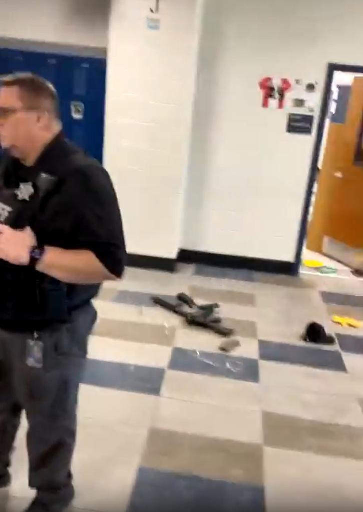 Rifle lying on the ground in a classroom at Apalachee High School after a shooting incident