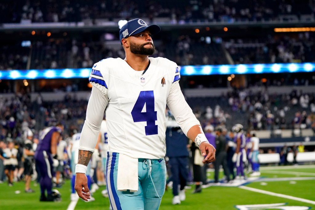 Dak Prescott walks off the field following a Week 3 loss to the Ravens.