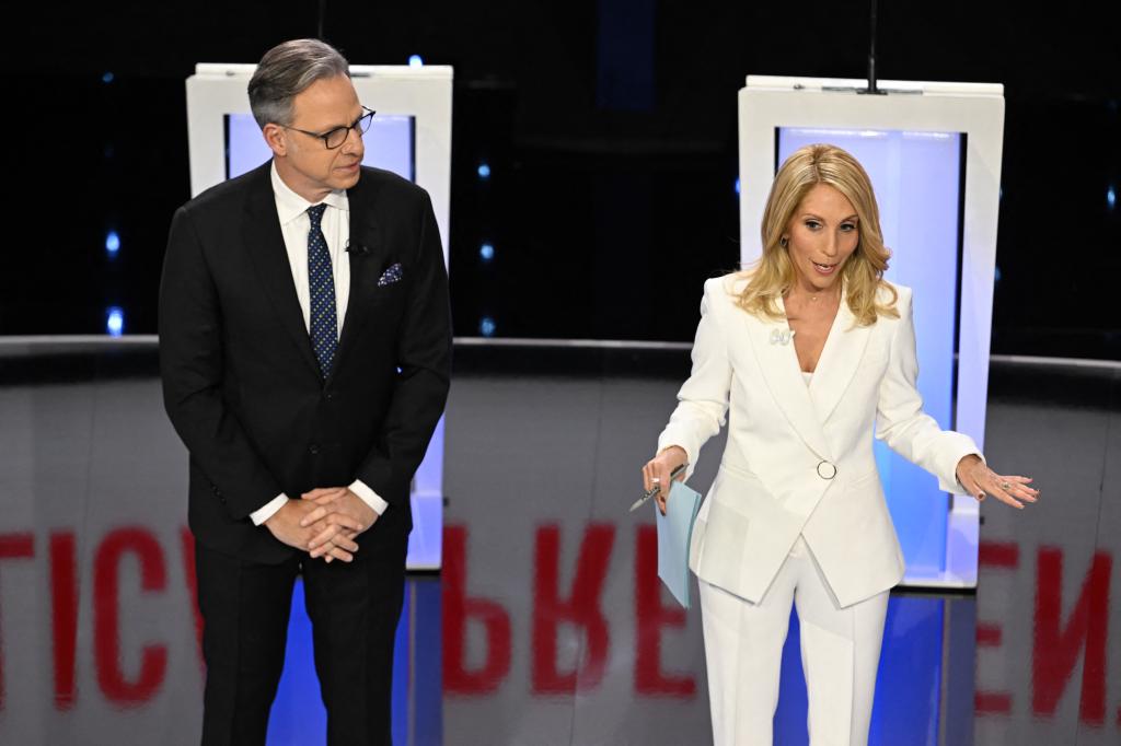 CNN anchors Jake Tapper and Dana Bash speaking on stage ahead of the fifth Republican presidential primary debate at Drake University.