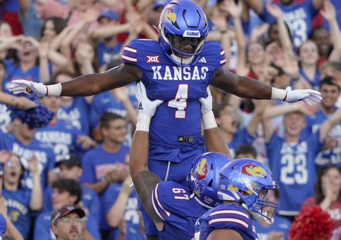 Running back Devin Neal and Kansas host UNLV on Friday night in a rematch of last season's Guaranteed Rate Bowl.