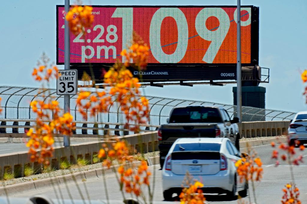 A digital billboard displays the temperature Monday, July 17, 2023 in downtown Phoenix. 