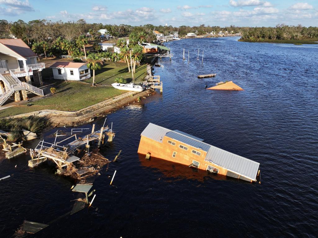 Drone view of a flooded and damaged area in Steinhatchee, Florida due to Hurricane Helene, showing a house submerged in water