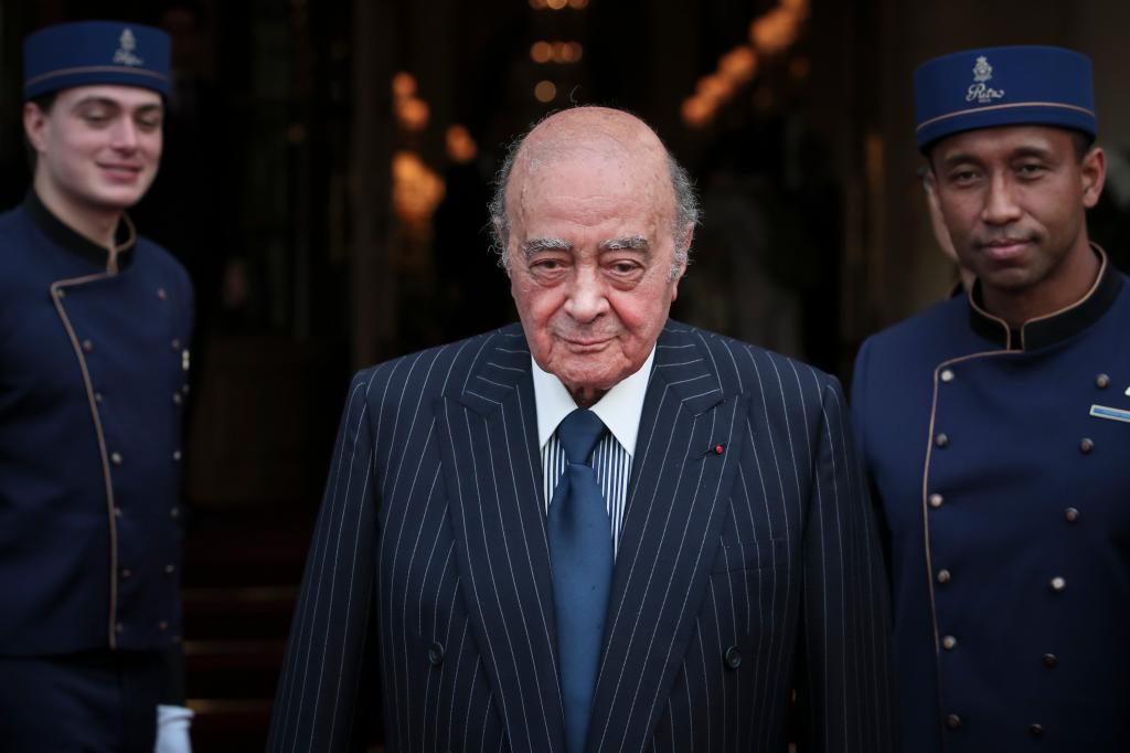 Mohamed Al-Fayed, Egyptian businessman and Ritz hotel owner, posing with his hotel staff in Paris in 2016.