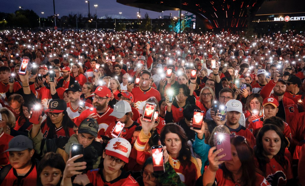 Fans attend a vigil for former Calgary Flames player Johnny Gaudreau and his brother Matthewin Calgary, Alberta, Wednesday, Sept. 4, 2024.