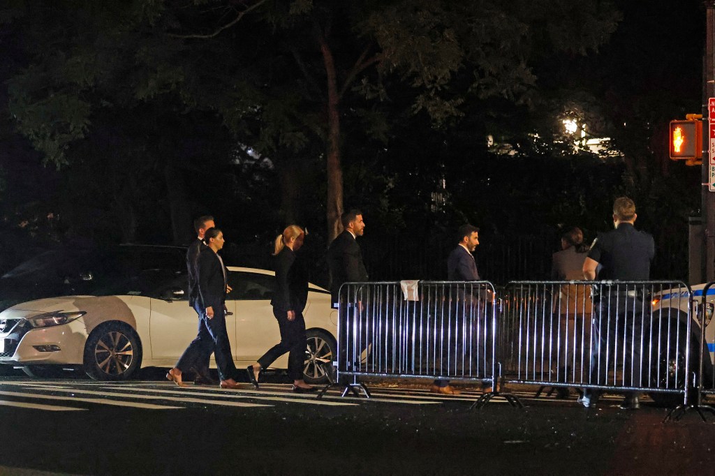 The men and women, who were all clad in business attire, filed into the mansion shortly before 6 a.m. hauling briefcases and bags.  