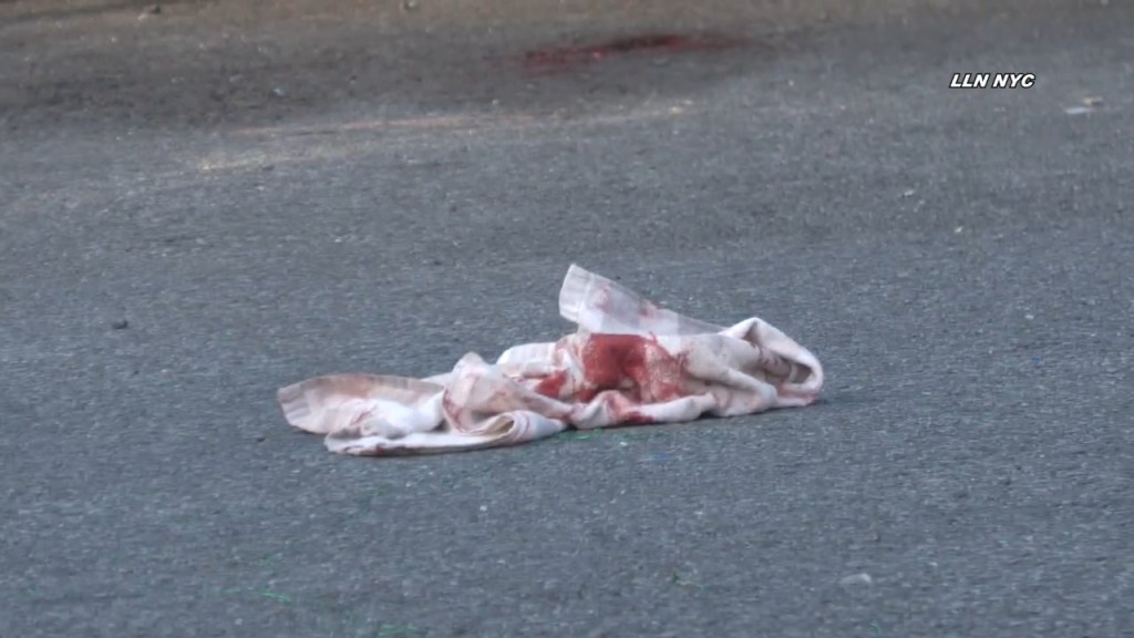 A bloody piece of evidence sits in the street.