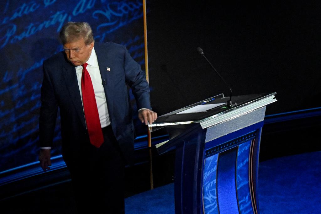 Republican presidential candidate Donald Trump walks away during a commercial break as US Vice President and Democratic presidential candidate Kamala Harris