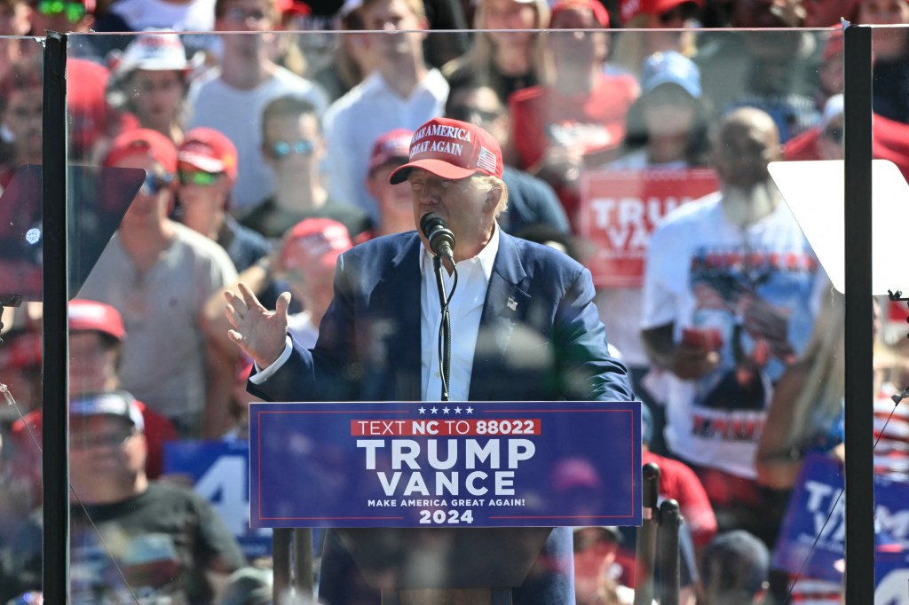 Former US President and Republican presidential candidate Donald Trump speaks during a campaign rally at the Aero Center in Wilmington, North Carolina, September 21, 2024.