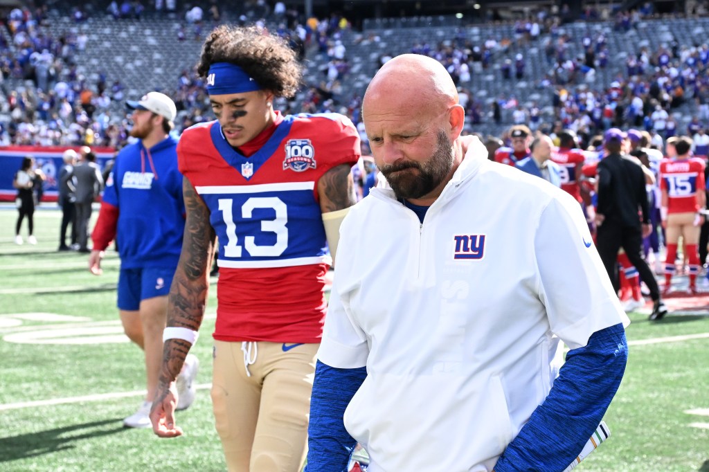 Brian Daboll and wide receiver Jalin Hyatt (13) walk off the field after the Minnesota Vikings beat the Giants 28-6 at MetLife Stadium in East Rutherford, N.J. 