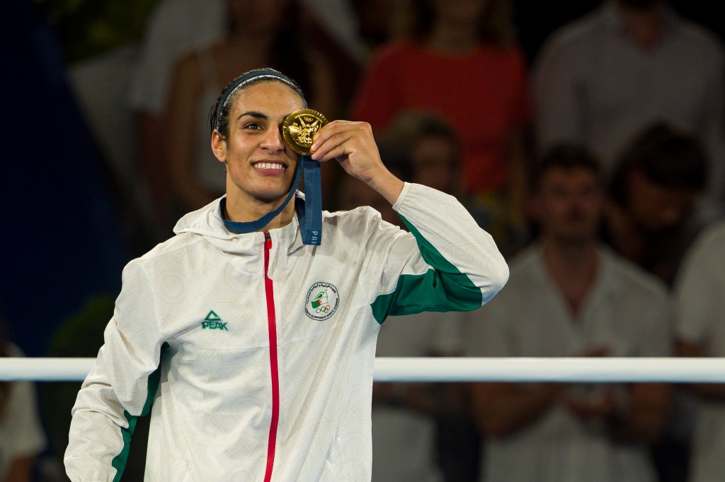 Medallist Imane Khelif of Team Algeria celebrates during the Boxing Women's 66kg medal ceremony after the Boxing Women's 66kg Final match on day fourteen of the Olympic Games Paris 2024 at Roland Garros on August 09, 2024 in Paris, France.