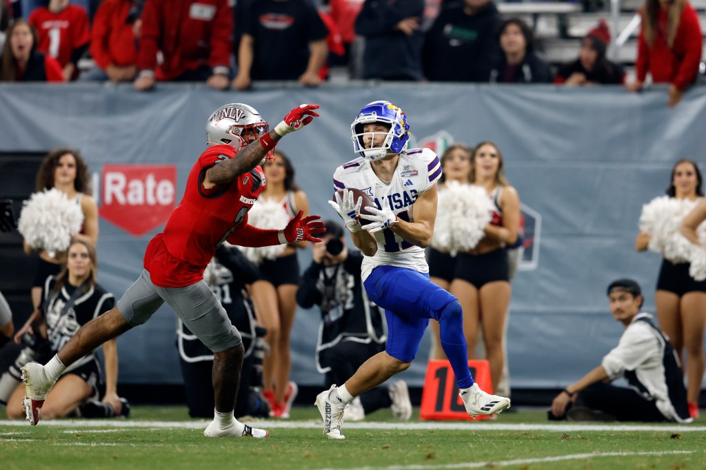 Wide receiver Luke Grimm and the Jayhawks won a shootout against UNLV in last season's Guaranteed Rate Bowl.