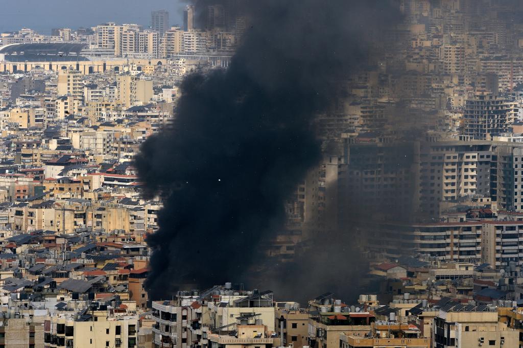 Smoke rises following Israeli strikes in the southern suburbs of Beirut.