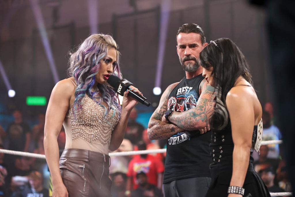 Giulia, CM Punk and Roxanne Perez in the ring last week.