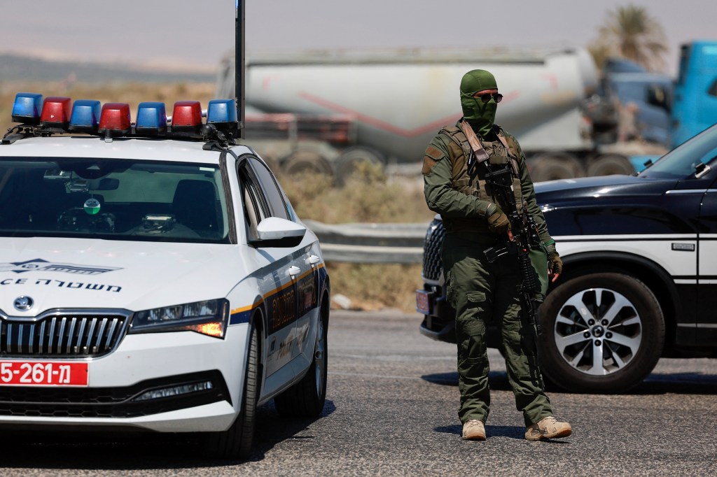 An Israeli soldier stands guard near the Allenby Bridge Crossing after a shooting attack that killed three Israelis on Sept. 8, 2024.