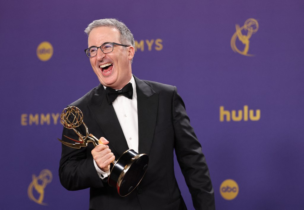 John Oliver poses with the Outstanding Scripted Variety Series award for "Last Week Tonight with John Oliver" at the 76th Primetime Emmy Awards