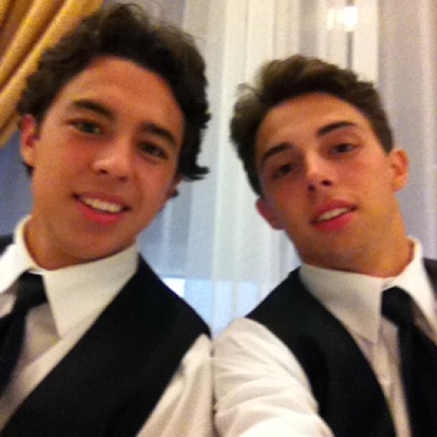 Johnny Gaudreau and Matthew Gaudreau, Columbus Blue Jackets NHL hockey players, posing for a selfie in suits