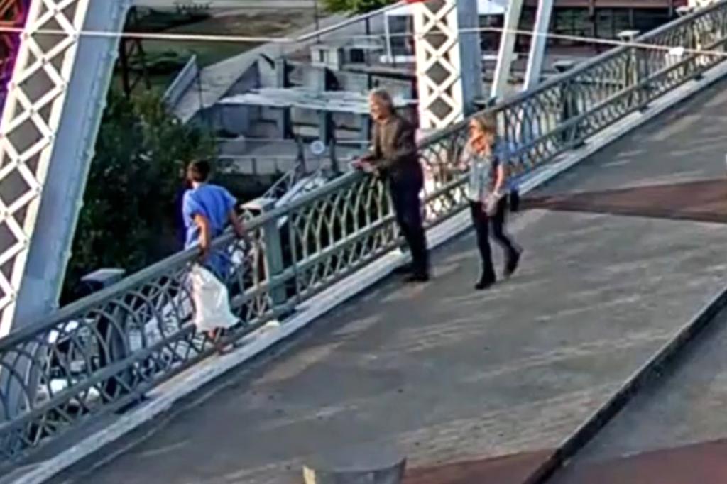 Jon Bon Jovi and a colleague talking to a distressed individual on John Seigenthaler Pedestrian Bridge in Nashville