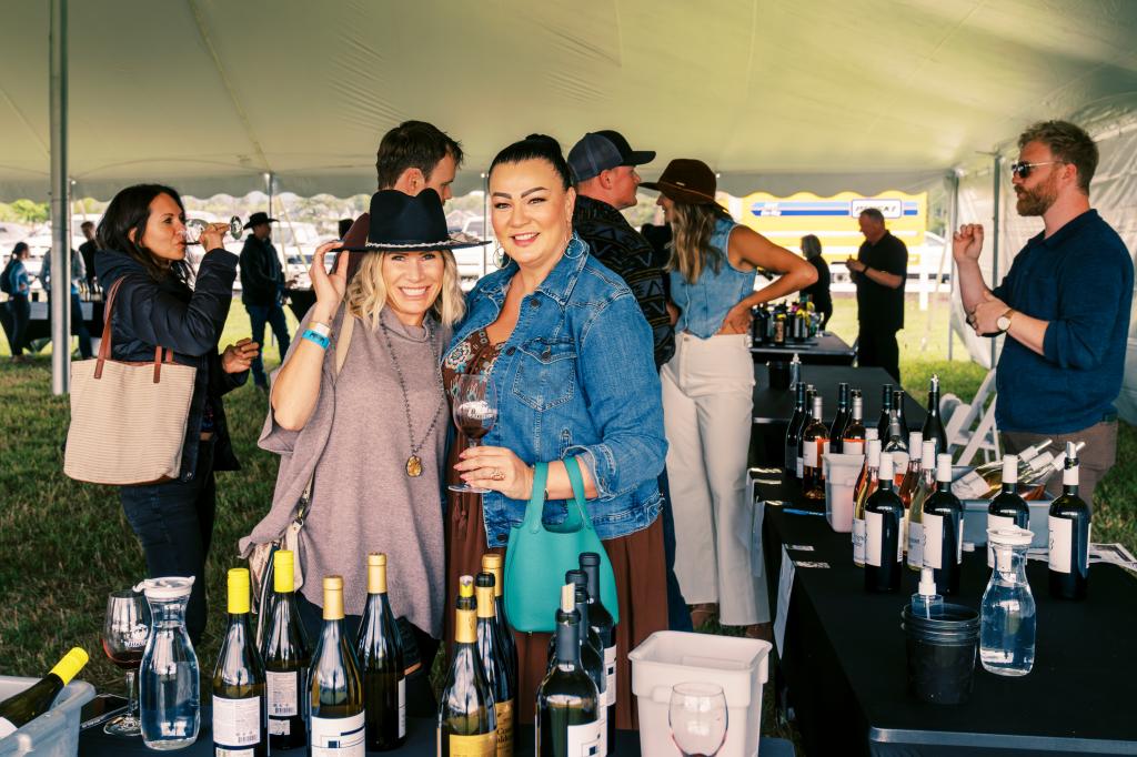 Attendees enjoy wine samples 