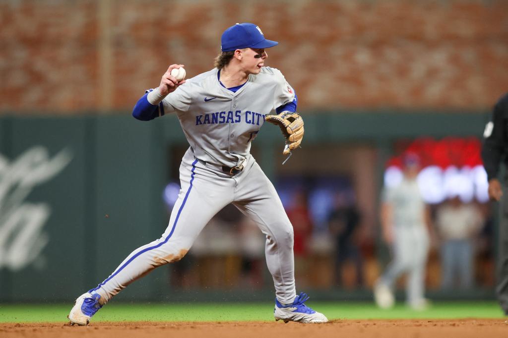 Kansas City Royals shortstop Bobby Witt Jr. (7) throws a runner out at first against the Atlanta Braves in the eighth inning at Truist Park.