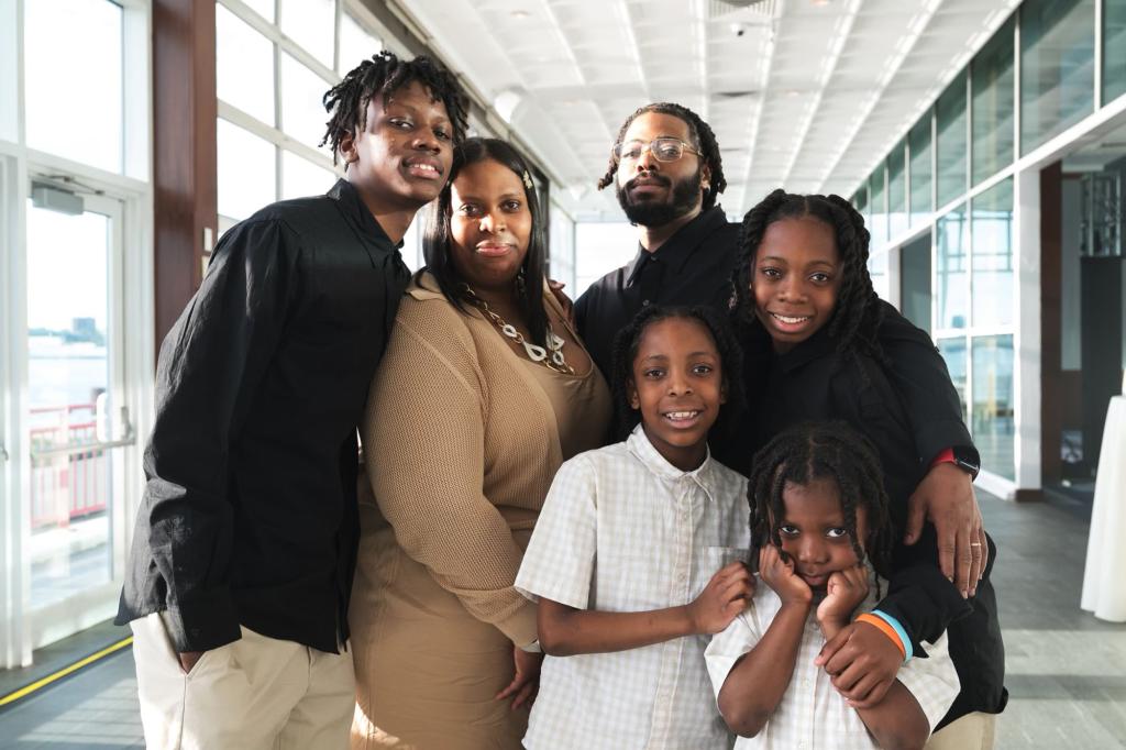 Kavion Brown Godfrey posing with his familiy.