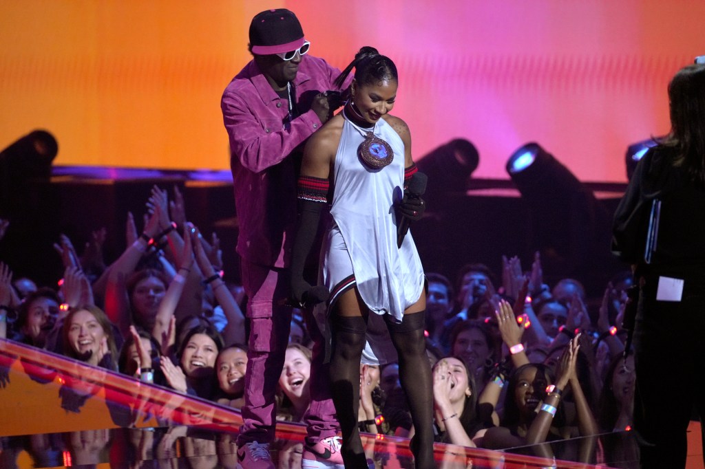 Flavor Flav and Jordan Chiles speak on stage during the 2024 MTV Video Music Awards at UBS Arena on September 11, 2024 in Elmont, New York. 