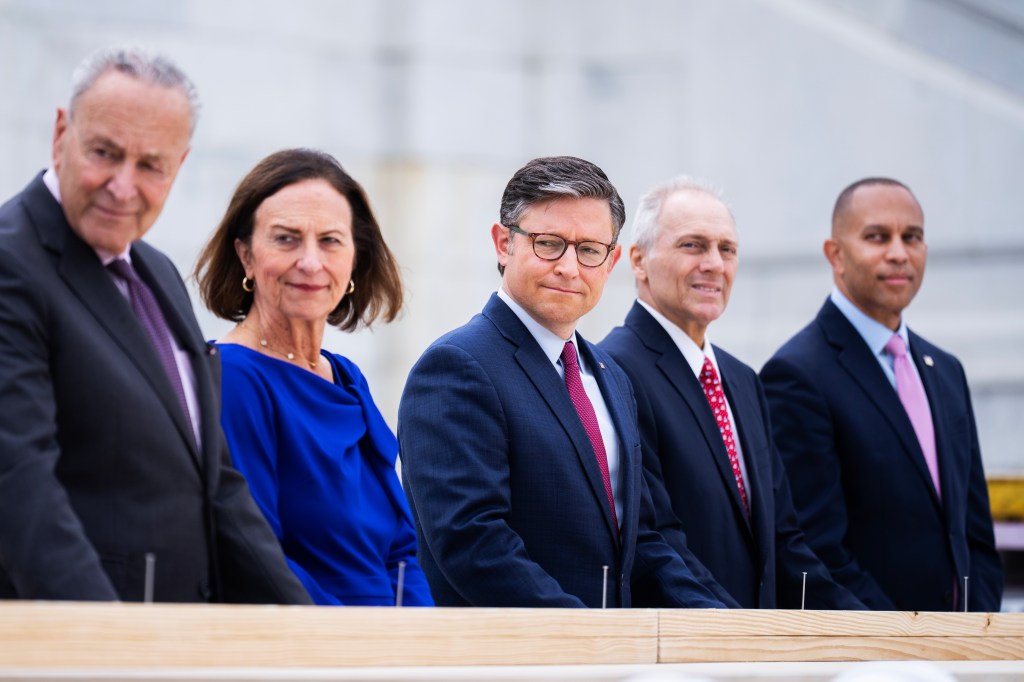 From left, Senate Majority Leader Charles Schumer, D-N.Y., Sen. Deb Fischer, R-Neb., Speaker of the House Mike Johnson, R-La., House Majority Leader Steve Scalise, R-La., and House Minority Leader Hakeem Jeffries, D-N.Y., participate in the "first nail ceremony," marking the start of construction of the inauguration platform on the West Front plaza of the U.S. Capitol on Wednesday, September 18, 2024.