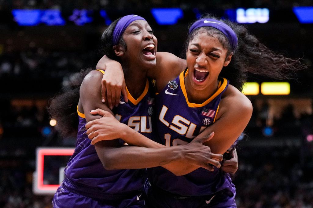 LSU Lady Tigers guard Flau'jae Johnson, left, celebrates with forward Angel Reese after defeating the Virginia Tech Hokies in semifinals of the women's Final Four of the 2023 NCAA Tournament at American Airlines Center.  