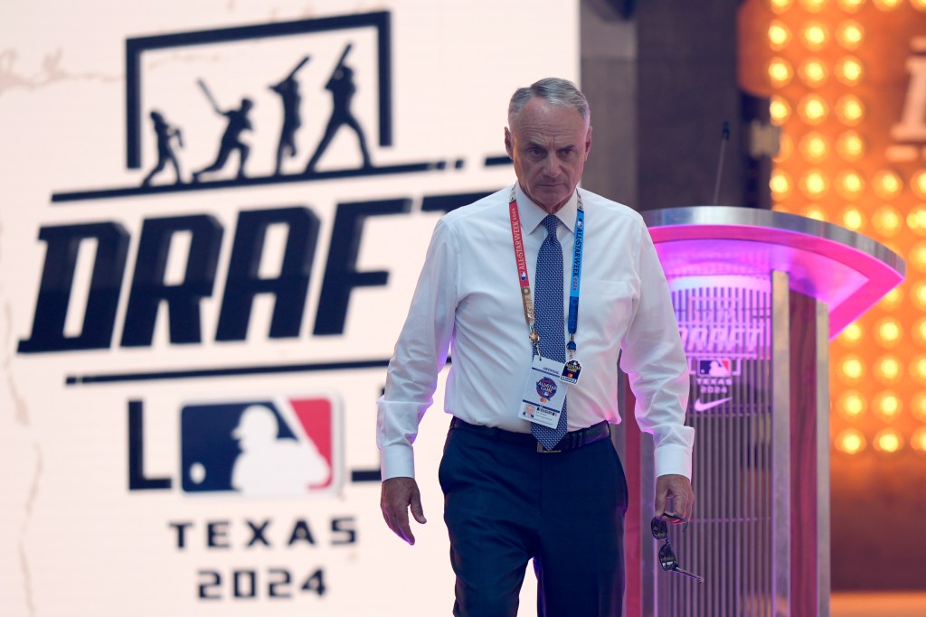  at 19:05 
Major League Baseball Commissioner Rob Manfred walks onto the stage before MLB baseball draft