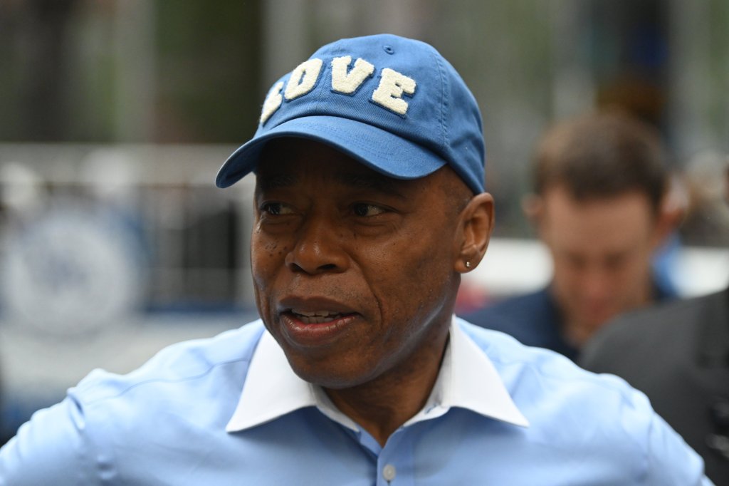 Eric Adams wearing a "love" hat