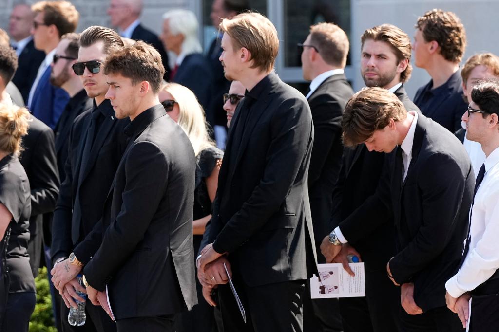 Members of the Columbus Blue Jackets leave St. Mary Magdalen Parish following the funeral service for teammate Johnny Gaudreau and his brother, Matthew Gaudreau.