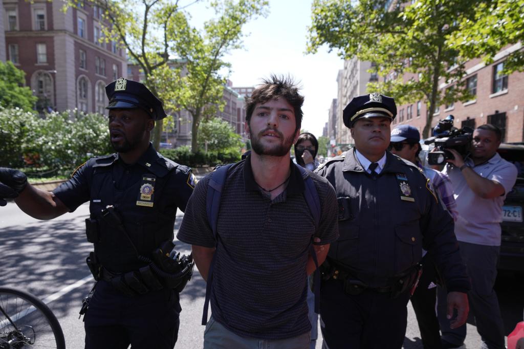 New York City Police Department officers arresting a pro-Palestine protestor during a demonstration outside Barnard College of Columbia University on the first day of Fall semester, 2024