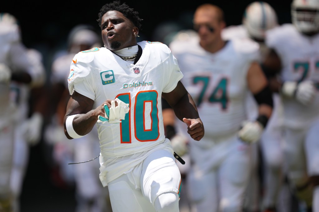 Miami Dolphins wide receiver Tyreek Hill (10) takes the field before the game against the Jacksonville Jaguars at Hard Rock Stadium.