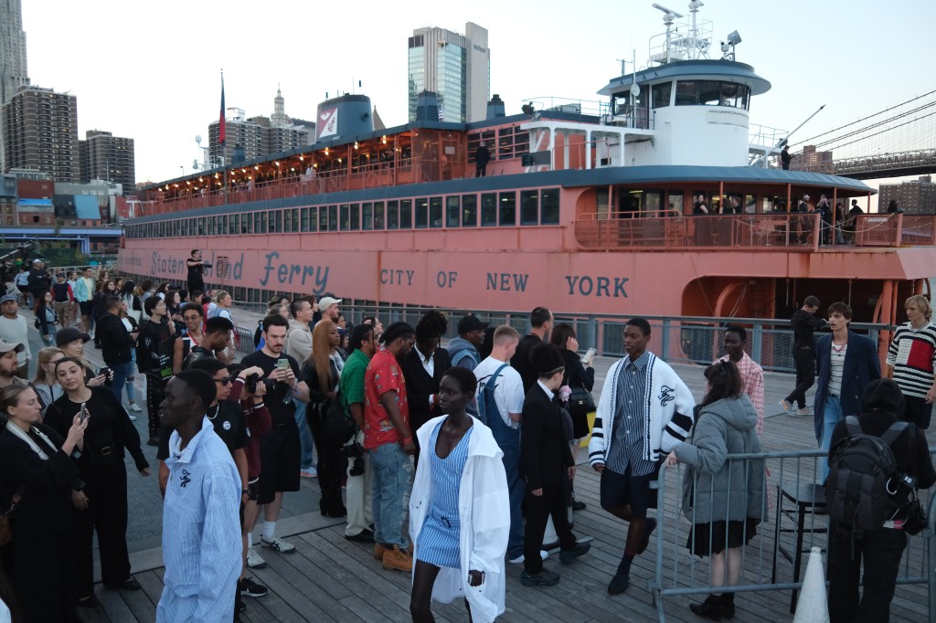 A photo of models leaving the MV John F. Kennedy ferryboat at Pier 17 at the end of a Tommy Hilfiger spring 2025 show on Sunday.