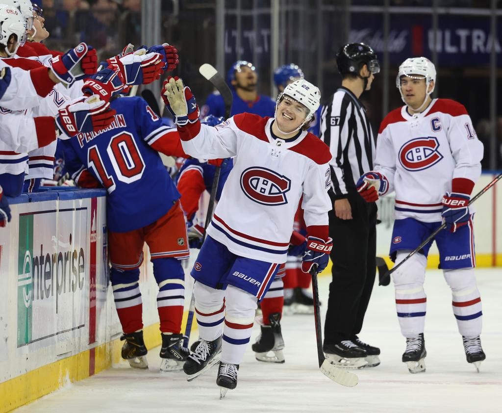 Cole Caufield celebrates a game-winning goal against the Rangers in 2023.