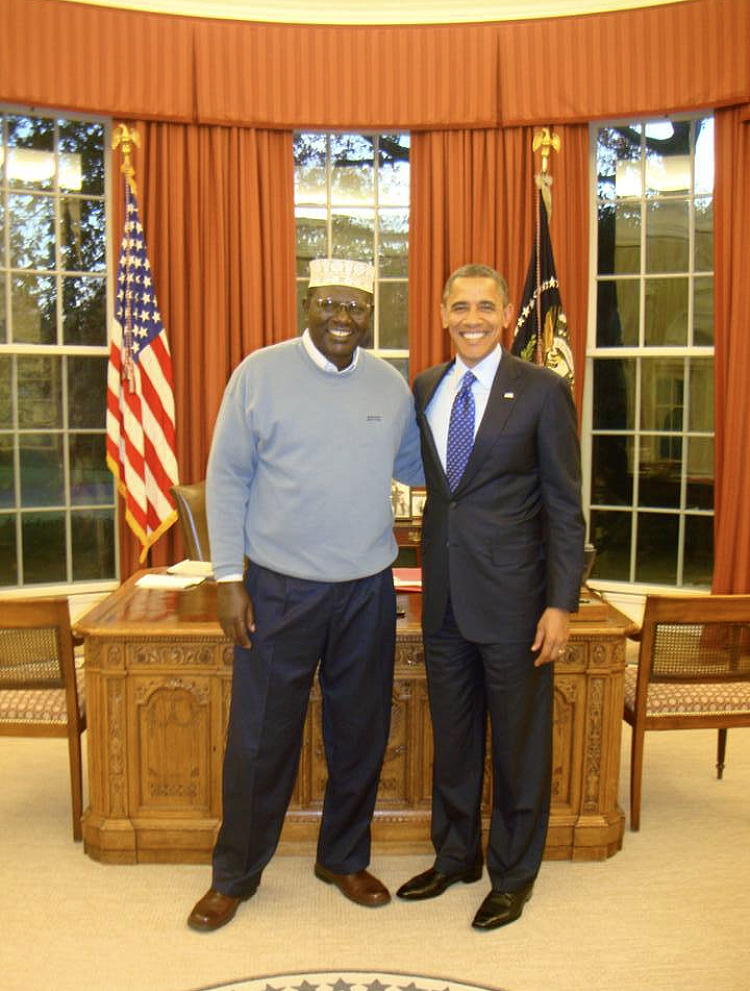 Malik Obama and President Barack Obama pictured in the Oval Office at the White House in November 2012