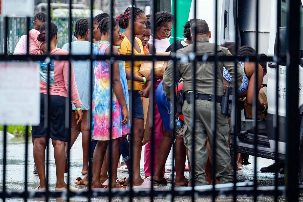 A group of Haitian migrants at a US Customs and Border Protection facility after arriving in Florida on June 26, 2024.