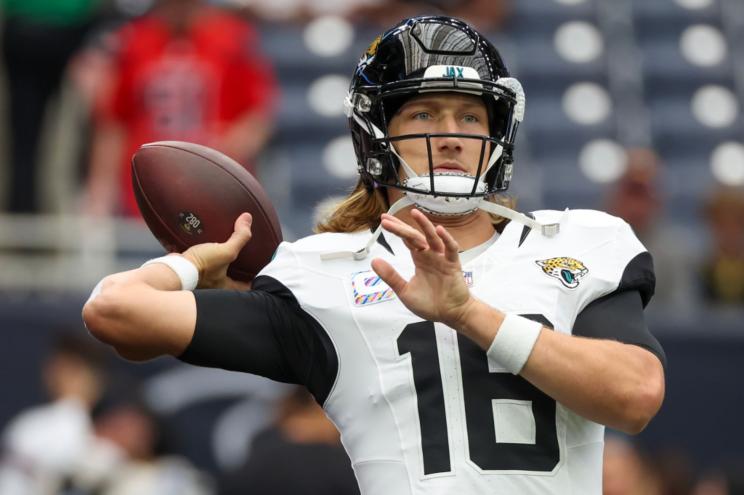 Jaguars quarterback Trevor Lawrence (16) warms up before playing against the Houston Texans.