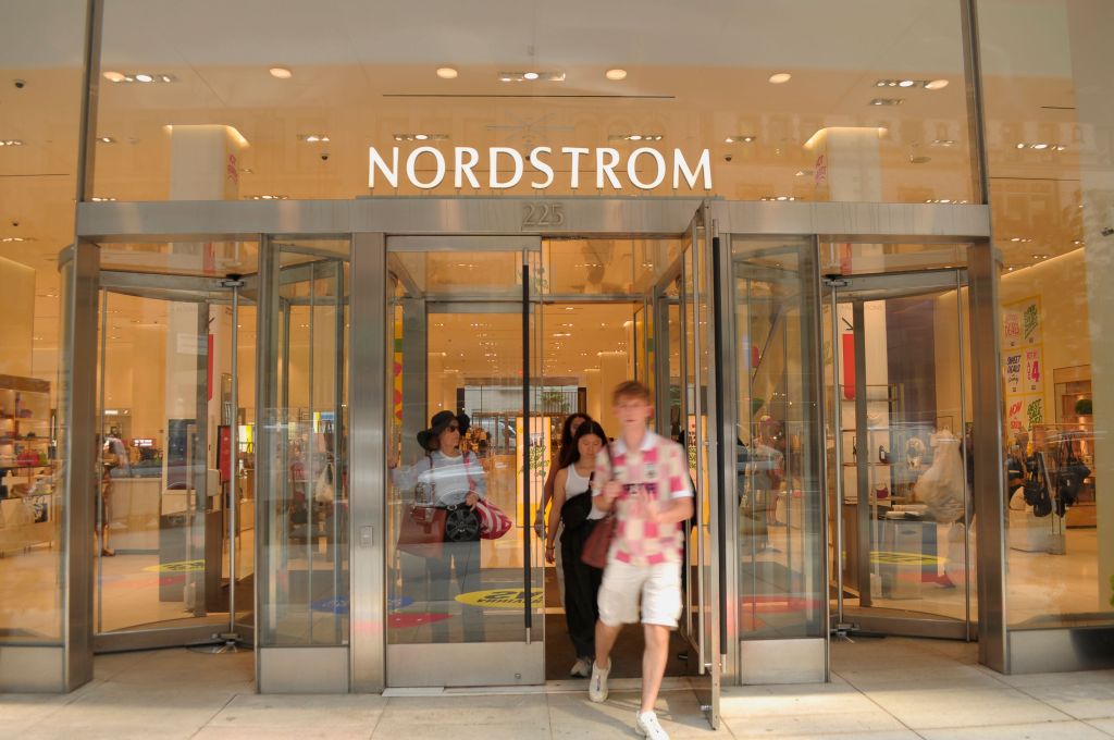 Nordstrom store in Manhattan, New York City with people walking in, sales sign indicating growth, and Mami Yamaguchi spotted