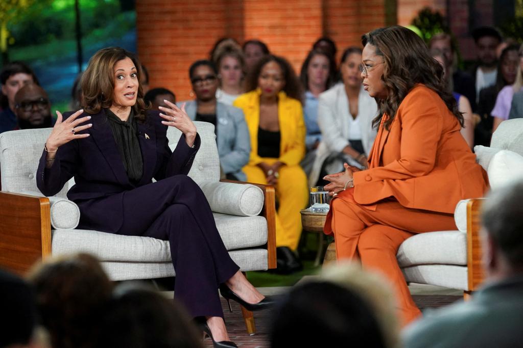 Oprah Winfrey speaking with Democratic presidential nominee Kamala Harris at a campaign event in Detroit, Michigan, 2024