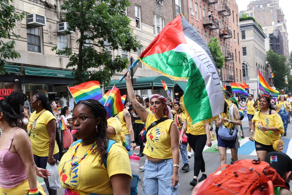 A person waving a Palestinian flag at the the 2024 NYC Pride March in Manhattan on June 30, 2024.