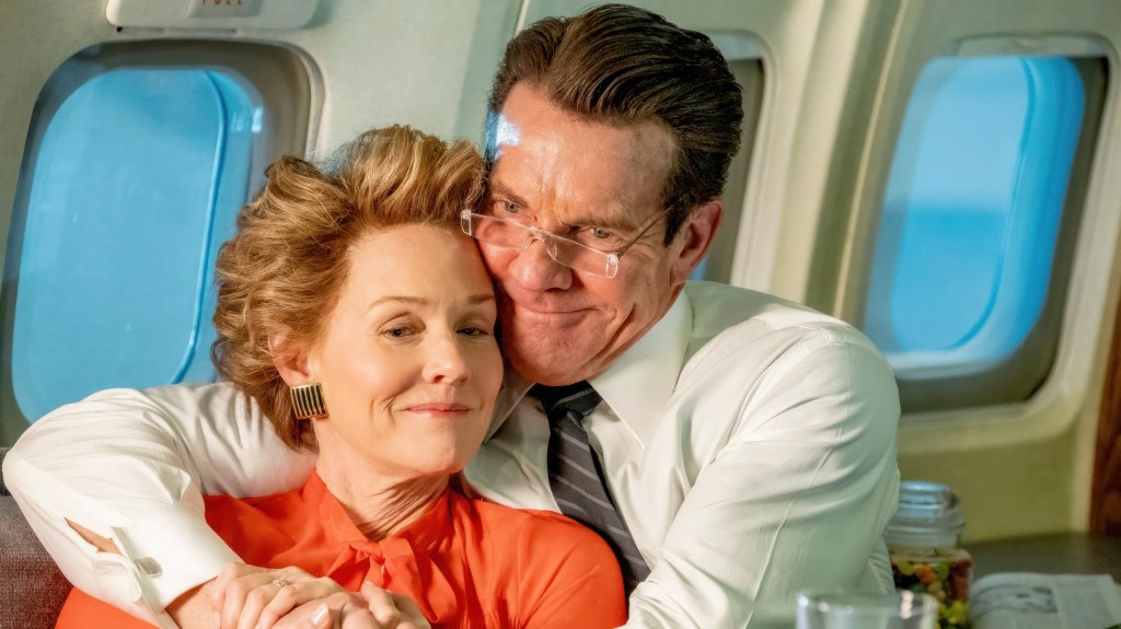 Dennis Quaid as Ronald Reagan hugs Penelope Ann Miller playing Nancy Reagan.