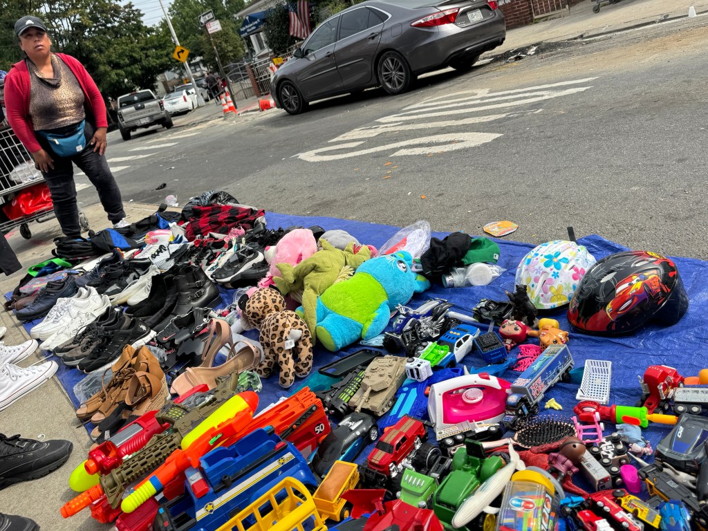 Migrants peddle stolen goods in Queens.