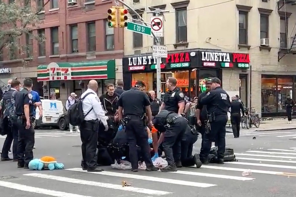 A brute randomly bashed an elderly woman in the face with a ceramic plate – and then attacked two NYPD cops who tried to cuff him in Manhattan Tuesday, authorities and sources said.