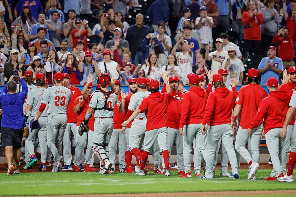 The Phillies celebrate after defeating the Mets on Sept. 20.