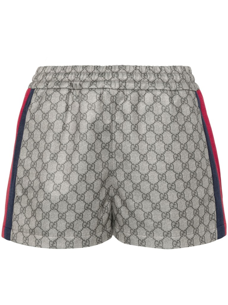 A pair of Gucci web-stripe logo-motif shorts in a sporty academia style